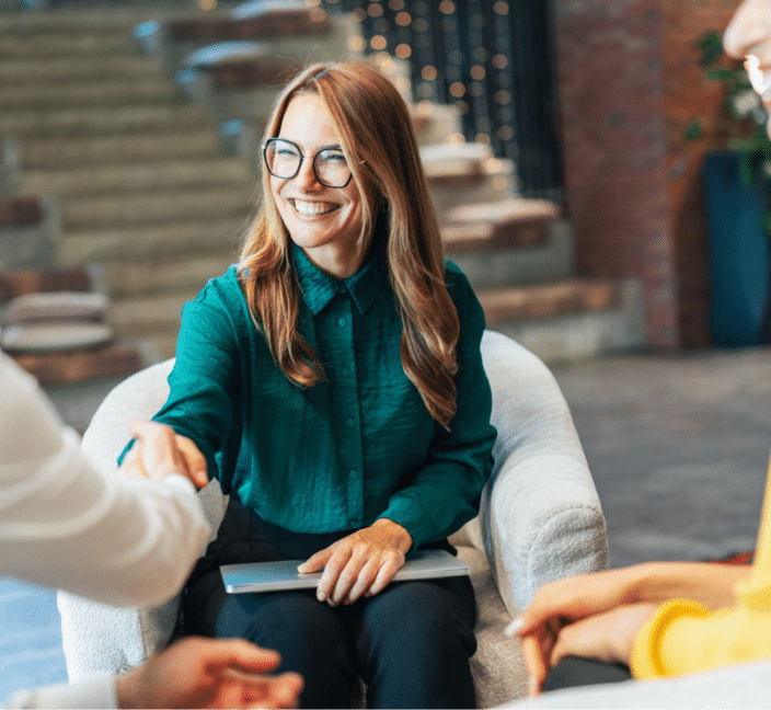 Woman smiling at an informal meeting